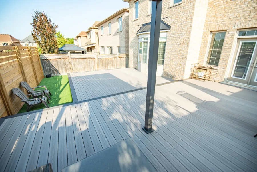 Grey Fiberon composite boards running straight across a Vaughan backyard, with no border and no stairs