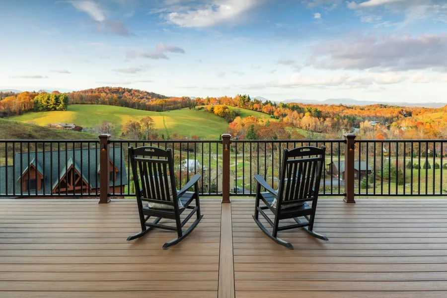 Trex Toasted Sand composite decking installed on an elevated deck with aluminum railing